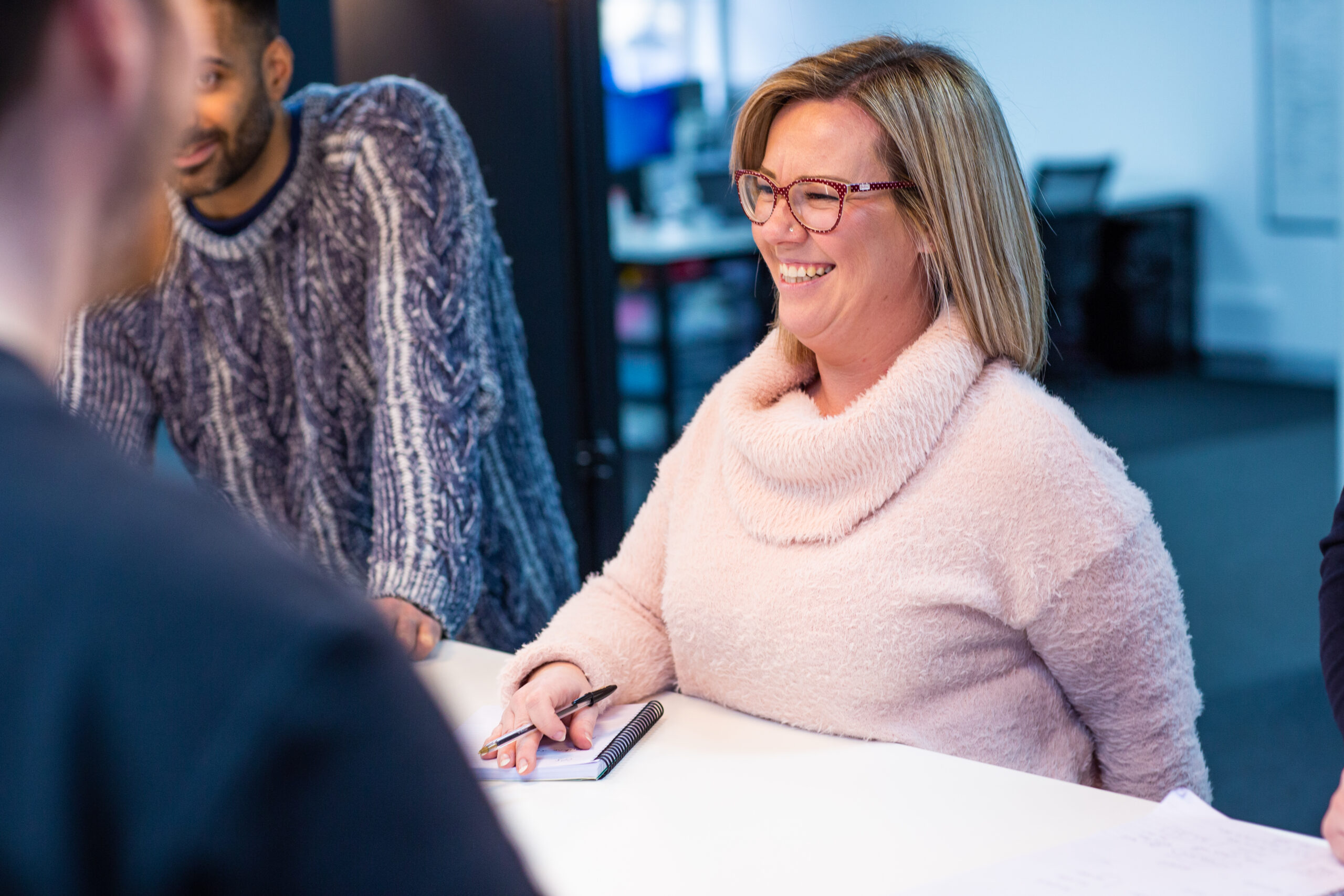 sales recruitment specialists gathered around a table