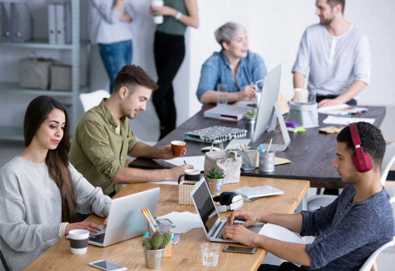 employees happily working back in the office