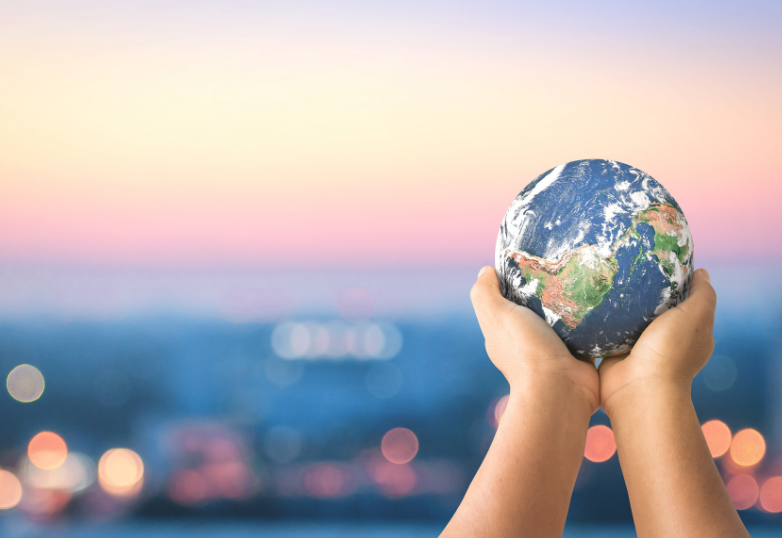 hands holding a globe