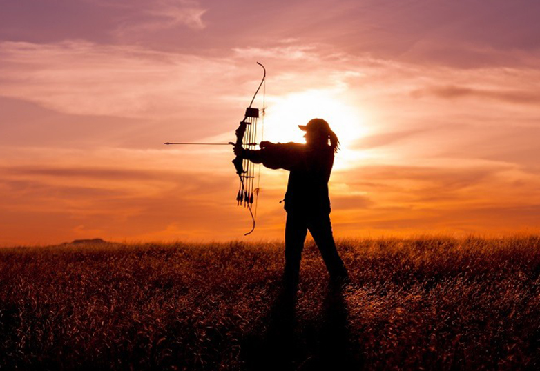 woman holding bow and arrow