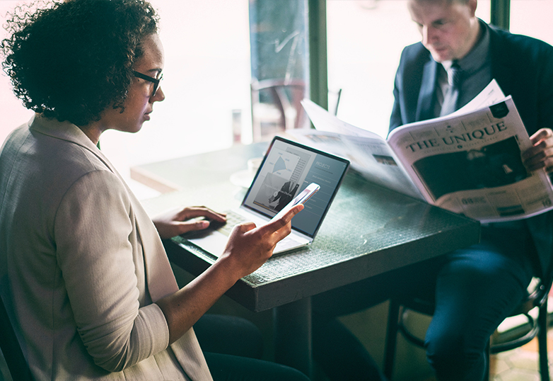 women at table checking job ads