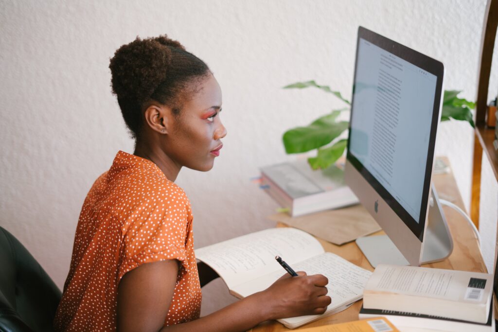 Woman studying in front of a computer screen